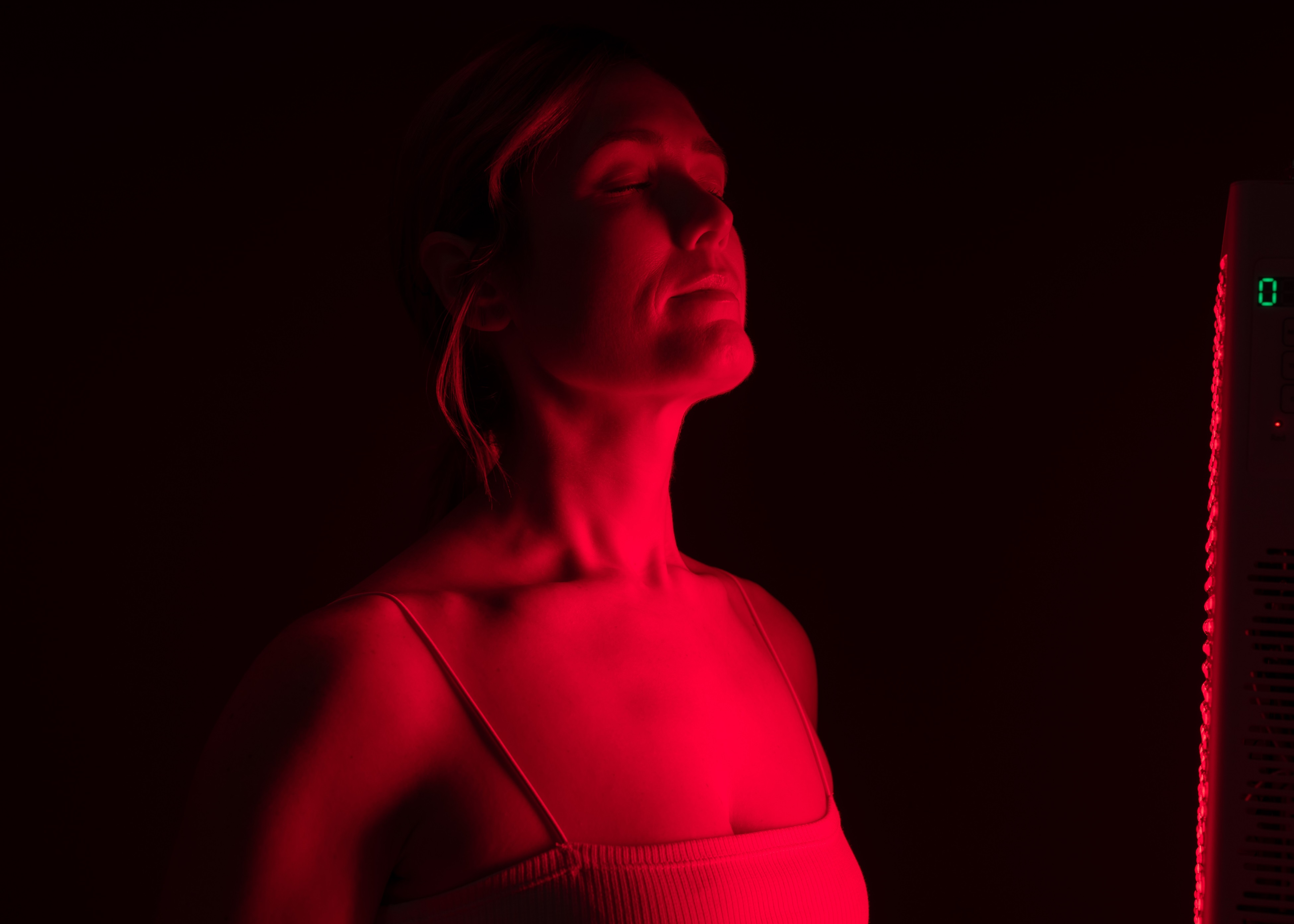 Woman receiving Red Light Therapy session