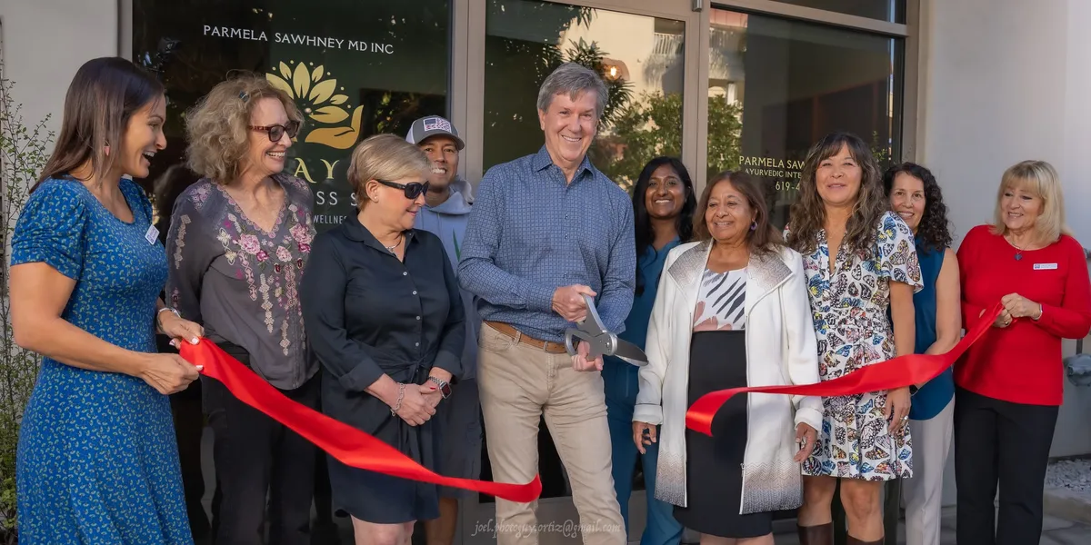 Ribbon cutting ceremony with Dr. Parmela Sawhney and Coronado community members celebrating the grand opening of Amaya Wellness Spa